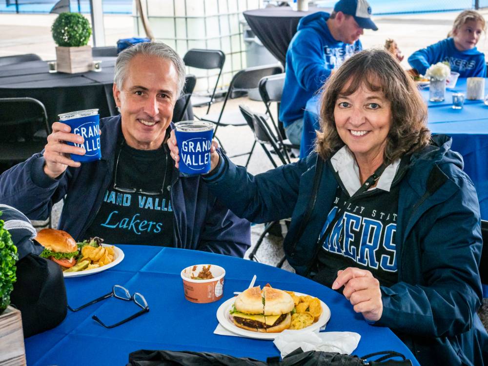Alumni raise a glass to Homecoming while enjoying delicious food